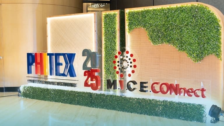 PHITEX 2025 MICE Connect sign with a green wall